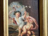 painting of two cherensils in a gold frame on a wall