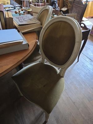 a table with a book on it and a chair with a book on it