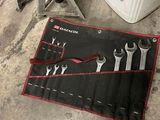 an image of a set of wrenches and tools in a garage