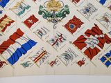 a close up of a square scarf with many different flags on it
