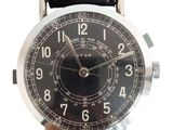 a close up of a wrist watch with a black leather strap