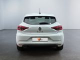 the rear end of a white car in a white room
