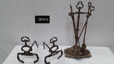 three metal sculptures that are sitting on a table