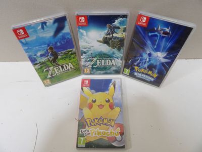Trois jeux Nintendo Wii sont posés sur une table