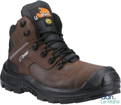 a close up of a pair of brown work boots on a white background