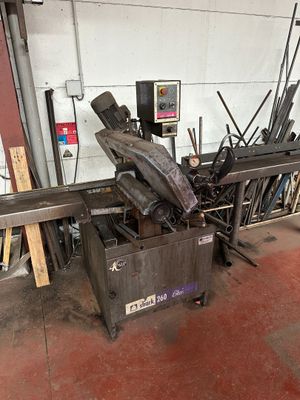 an image of a machine that is working on a piece of metal