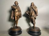 pair of antique bronze figures of a man and a woman