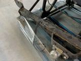 an image of a car being worked on in a garage