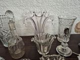 many glass vases sitting on a table next to each other