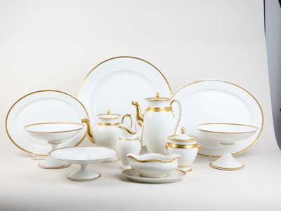 a lot of white and gold plates and cups