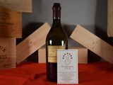 a bottle of wine that is sitting on a table