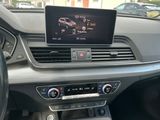 the dashboard of a car with a digital display in the center of it