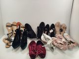 several pairs of women ' s shoes are lined up on a shelf