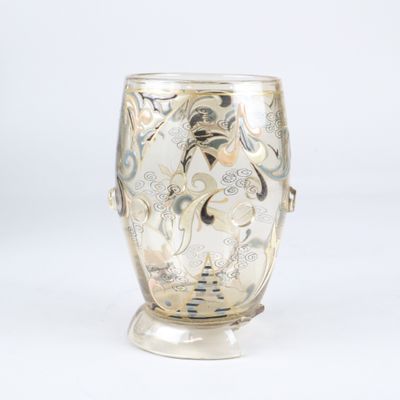 a glass vase that is sitting on a stand