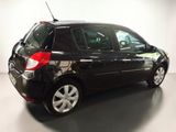 a picture of a small black car parked in a garage