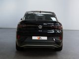 the back of a black volkswagen vw golf parked in a showroom