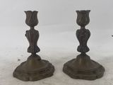 pair of bronze candlesticks in the form of a woman ' s head