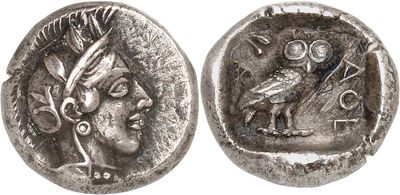 a silver coin with an image of a woman and a bird on it
