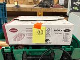 a box with a sticker on it sitting on top of a green container