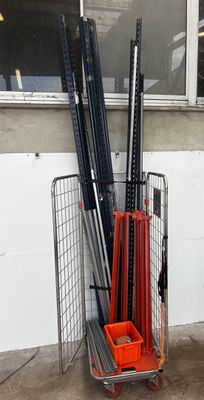 many baseball bats and bats in a cart outside of a building