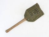 an old spatula with a wooden handle on a white surface