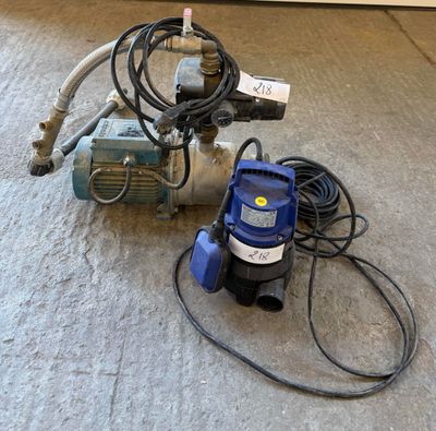 an image of a water pump and a hose on the floor