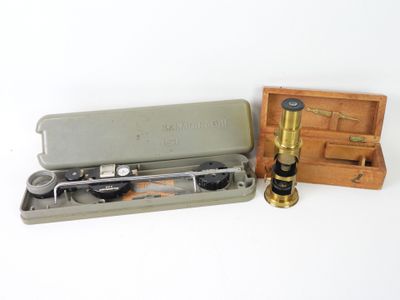 a small box with a pair of glasses and a pair of scissors