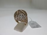 a close up of a gold ring with a tag on it