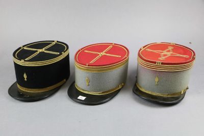 three hats are lined up on top of each other on a table