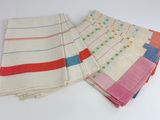 several different colored napkins are stacked on top of each other