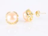 a pair of pearl and diamond stud earrings