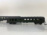 an image of a green train car sitting on top of a white table