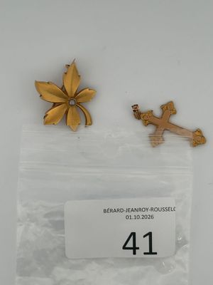 two pieces of jewelry are sitting in a bag on a table