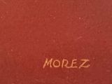 a red book with writing on it that says mollerz