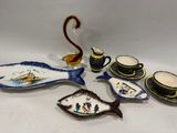 beaucoup d'assiettes, de tasses et de soucoupes sur la table
