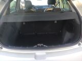 the back of a car with its trunk open and the back seats folded down