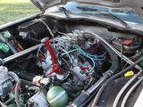a car engine that is sitting in the trunk of a car