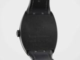 a close up of a watch with a black strap on a white background