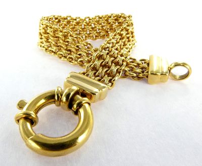 an image of a close up of a gold chain with a ring on it