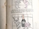 un vieux livre avec des illustrations représentant un chat et un chien