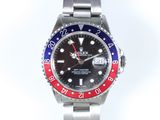rolex watch with red, blue, and red bezel