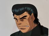 an image of a man with black hair and a black shirt