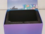 an image of a purple box with a black phone inside of it