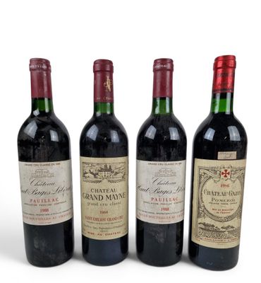 three bottles of red wine sit next to each other on a white surface