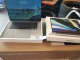 two laptops that are sitting on top of a box