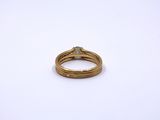 an image of a gold ring with a diamond on it