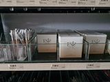 many boxes of cosmetics on a shelf in a store
