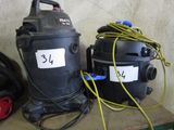 two vacuums that are sitting on a shelf next to each other