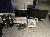 two laptops and speakers on the floor next to each other