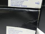 two boxes that are stacked on top of each other